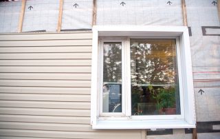 siding and insulation on home around window