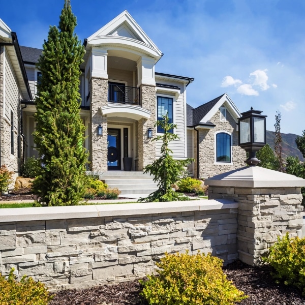 Modern Home Exterior With Stone Veneer in Utah Stone veneer exterior on a modern Utah home with remodeled front elevation