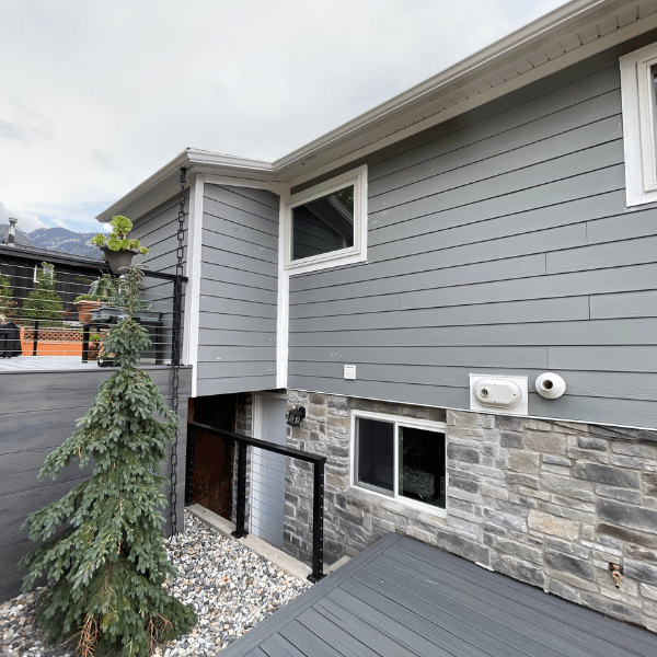 Renovation By Burbach Consultant Planning Siding Project Exterior siding contractor reviewing design plans with Utah homeowners