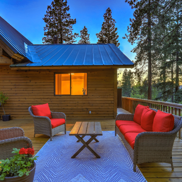 Satisfied homeowners after exterior siding renovation in Utah Happy Utah homeowners standing in front of their newly renovated home exterior